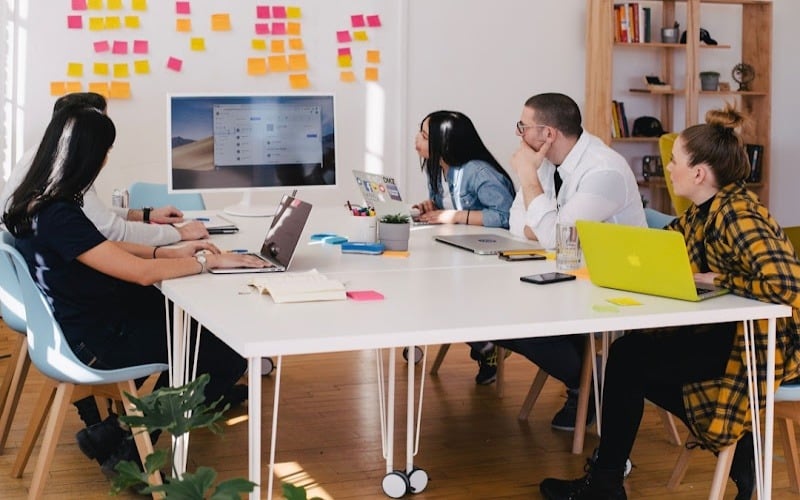 A team in an office discussing search as a service during a meeting